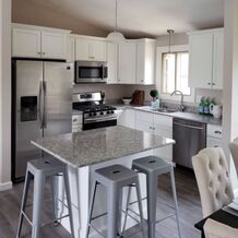 White, marble and stainless steel remodel